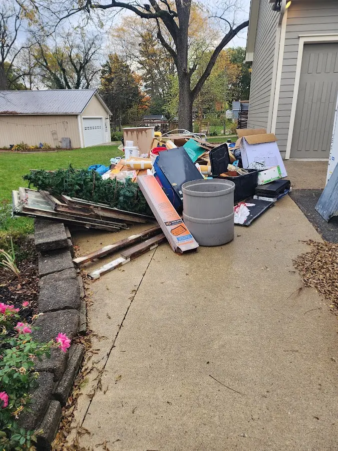 Dumpster being loaded with debris for 3 Yard Dumpster Rental in DuBois